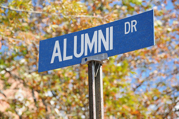 Alumni drive street sign close up stock photo