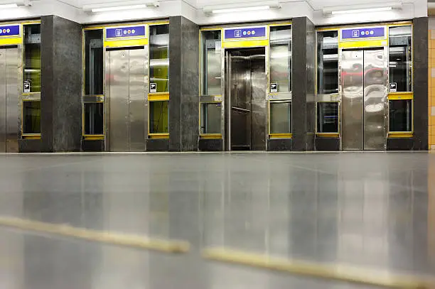 Photo of Subway scene, elevators in hallway