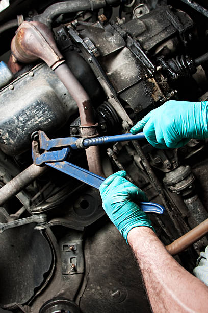 istock Mechanical repairs a car in the garage. 183354290