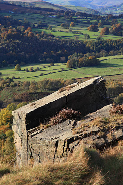 istock Gritstone outcrop in autumnal landscape 183354521