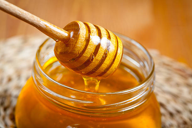 Pot of honey stock photo