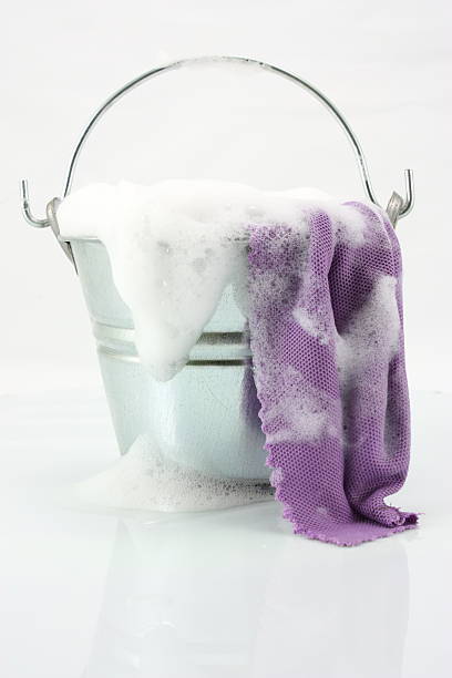 Cleaning time Soap Bucket with cloth. grey hair on floor stock pictures, royalty-free photos & images