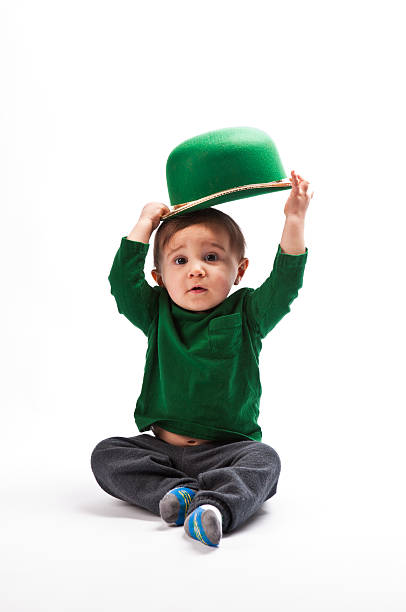 young boy holding Leprechaun hat stock photo