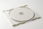 Isolated shot of CD with plastic case on white background