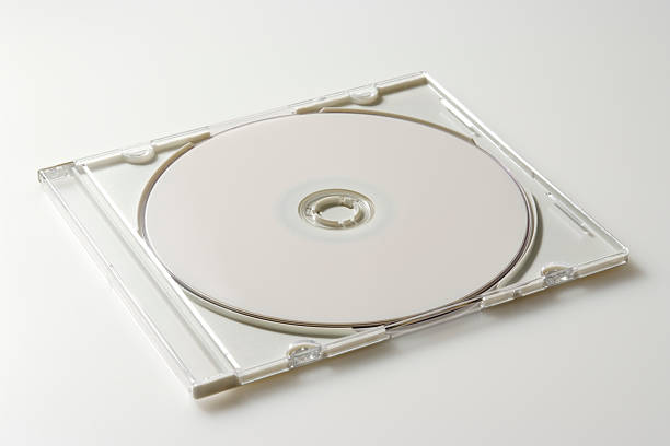 isolated shot of cd с пластиковый чехол на белом фоне - repetition cd dvd data стоковые фото и изображения