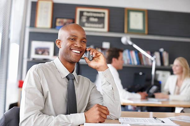 istock Cheerful business man on his phone 183355470