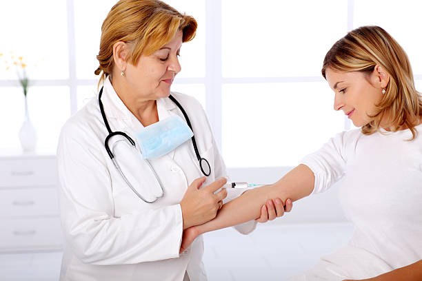 istock Doctor giving an injection to patient 183355777