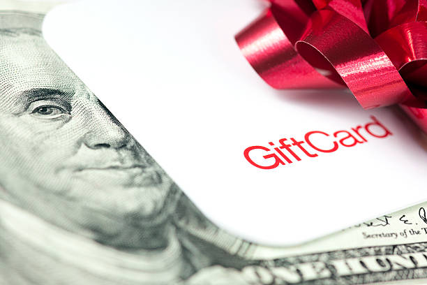 Giving a gift card stock photo