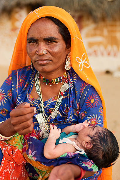 istock Indian woman holding her child 183356005