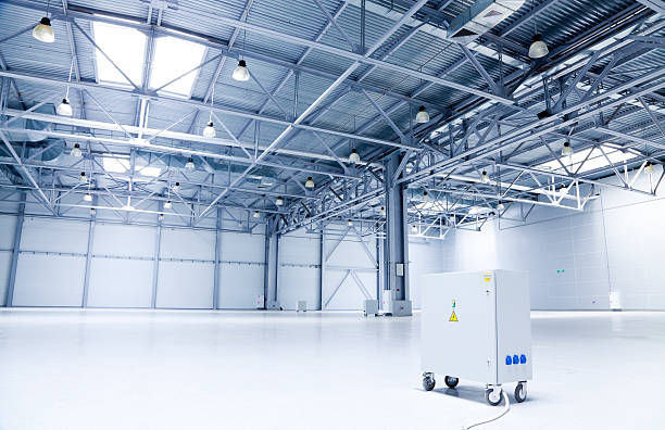 istock Large white and gray storehouse and one machine 183356011