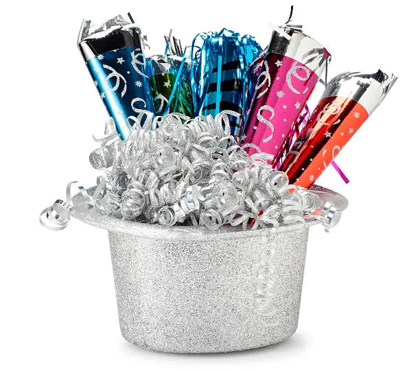 A silver New Year's Eve party hat filled with blowers and streamers.  Clipping path included.