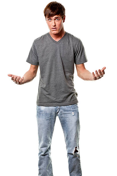 istock Confused Young Man Shrugging 183356654