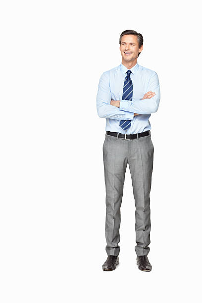 istock Smiling businessman with hands folded against white background 183357154