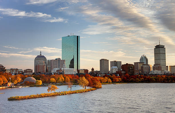 Autumn in Boston Autumn colors along the Charles River and Boston's Back Bay skyline. Boston is the largest city in New England, the capital of the state of Massachusetts. Boston is known for its central role in American history,world-class educational institutions, cultural facilities, and champion sports franchises. charles river stock pictures, royalty-free photos & images