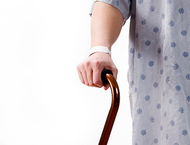 istock Hand, hospital ID, cane and gown. 183357624