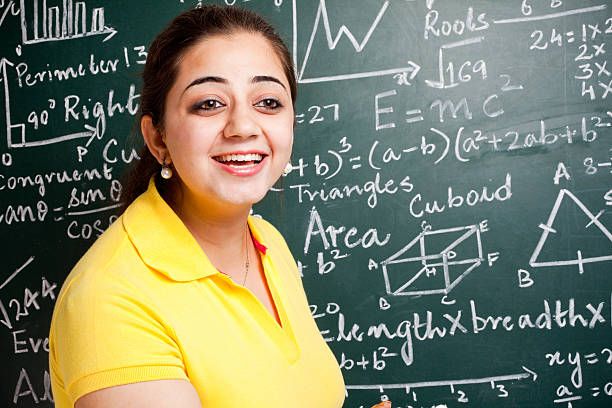 istock Attractive Young Cheerful Indian Mathematics Teacher in Classroom with Greenboard 183357743