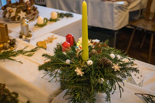 traditional Advent candles. Christmas arrangement of freshly cut fir branches, decorated with Christmas balls and candles, for table decoration. High quality photo