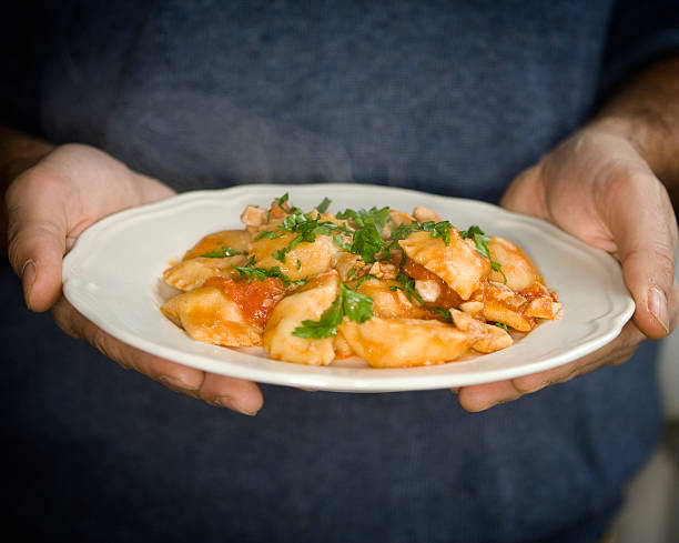 istock Ravioli, with Man's Hand Serving Dish 183358168