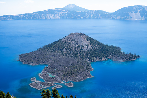Wizard Island is a cinder cone, a remnant of the volcanic activity which created Crater Lake.