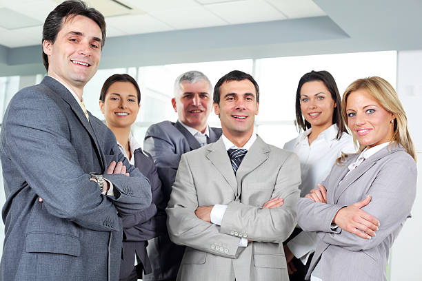 istock Successful business group are standing in a modern office. 183358256