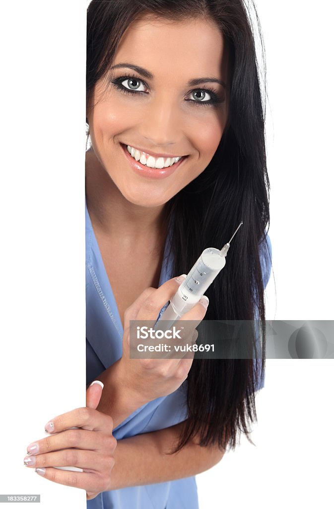 Happy Nurse Attractive young nurse with syringe looking at camera One Woman Only Stock Photo
