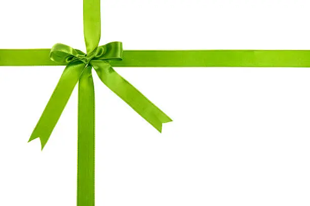 Green gift bow with ribbon on white background