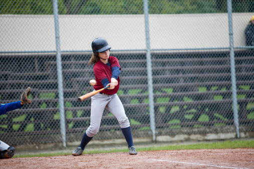 Girl Hitting the Baseball (she made it to second base)