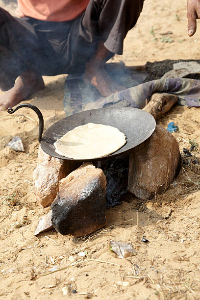 istock Indian man cooking chapati bread dough 183359065