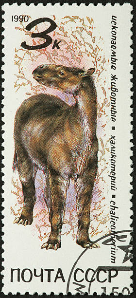 istock large pre-historic mammal on a stamp 183359194