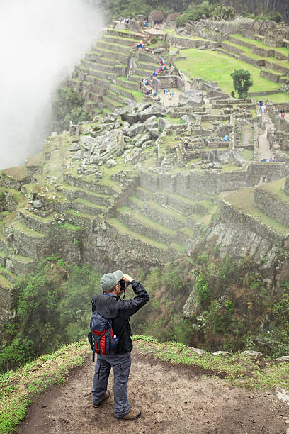istock Tourist photographing Machu Picchu 183359391