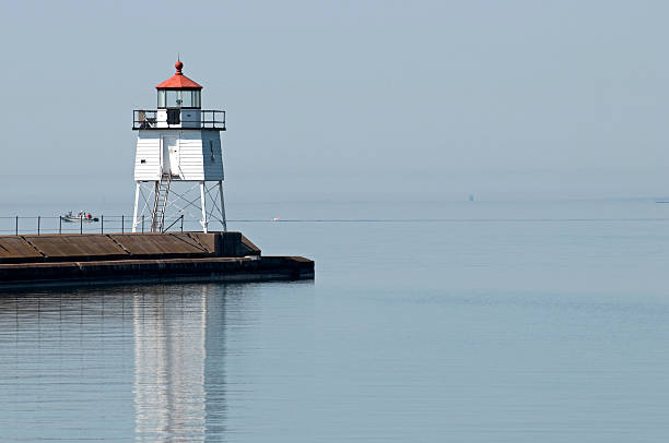 istock Lighthouse at entrance to harbor in Minnesota 183359413