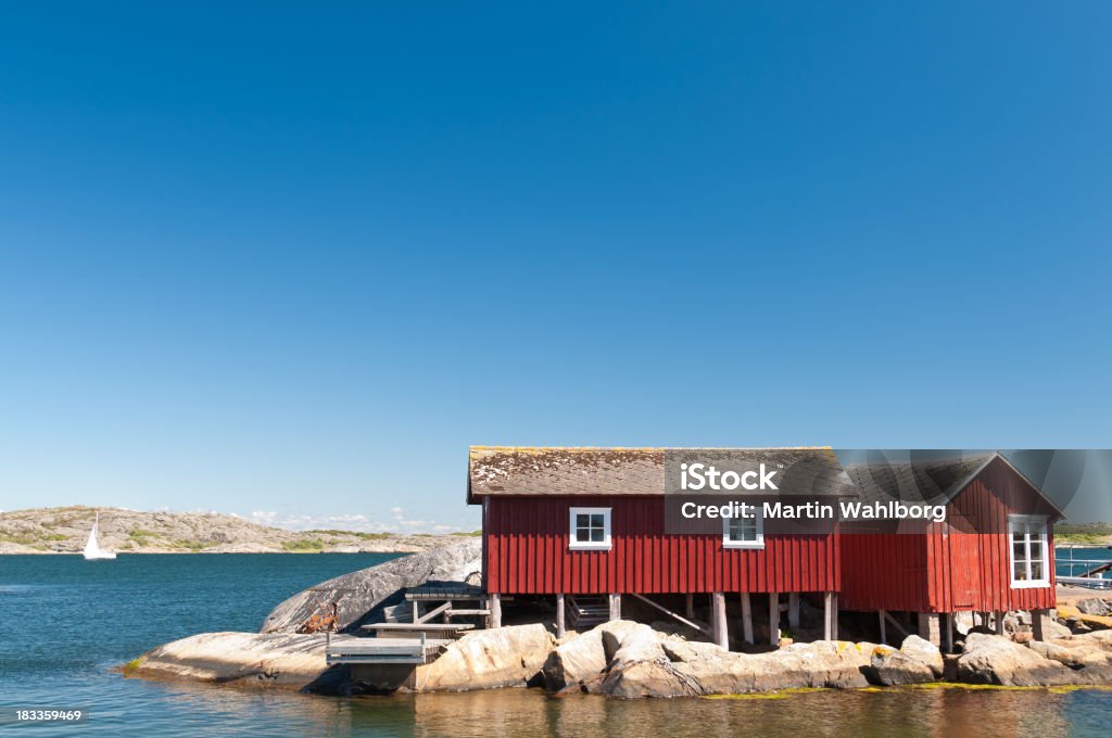 Idilliaca costa, capanne costruiti su pali - Foto stock royalty-free di Arcipelago