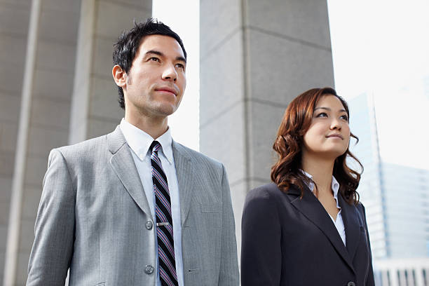 istock Confident business man and woman walking 183359587