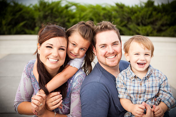 istock Happy Young Family Laughing Together Outside 183360077