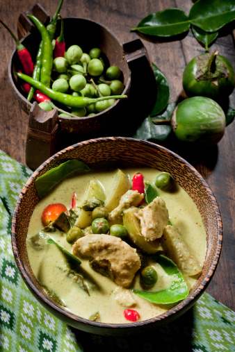 Thai Green Curry With Chicken & Fresh Ingredients As Garnishing.