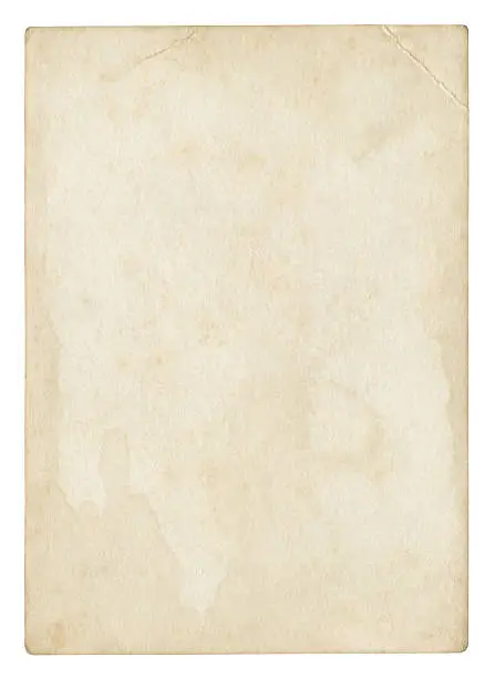 Photo of An old stained blank piece of beige paper