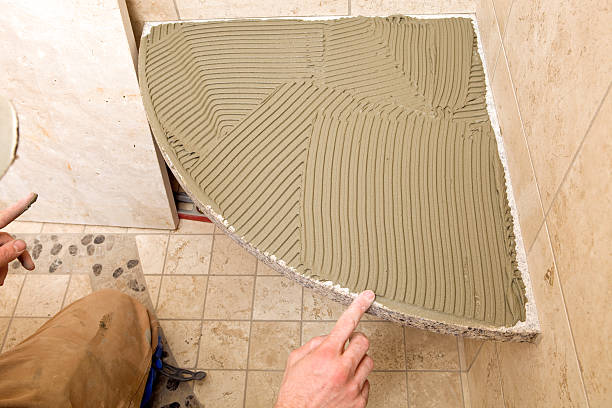 istock Tile Setter Smoothing Shower Seat Mortar with Finger 183360834