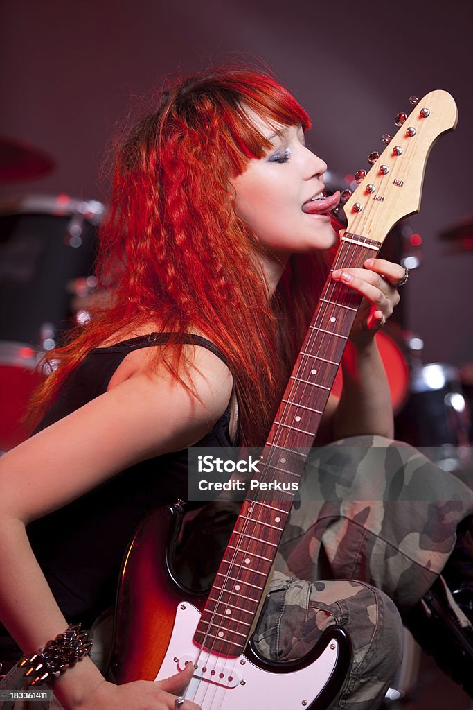 beautiful guitarist beautiful woman with guitar - studio  shoot Activity Stock Photo