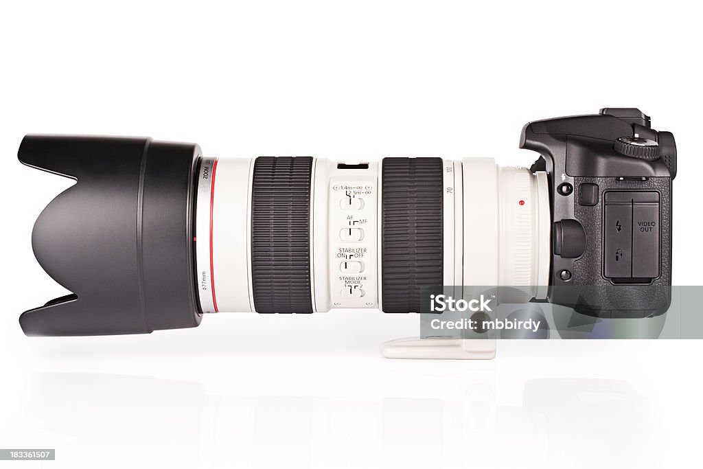 DSLR camera with telephoto lens 70-200mm, clipping path "DSLR camera with professional telephoto lens 70-200 mm, F2.8. Isolated on white, clipping path included." Camera - Photographic Equipment Stock Photo