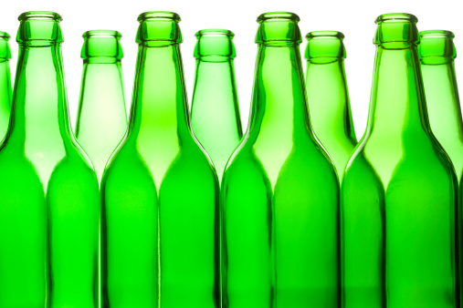 Glass bottle on a white background. Empty bottle. Green bottle on a clean background