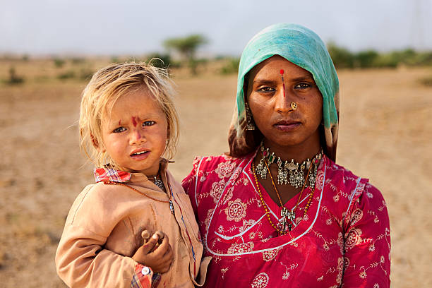 istock Indian woman holding her child 183363005