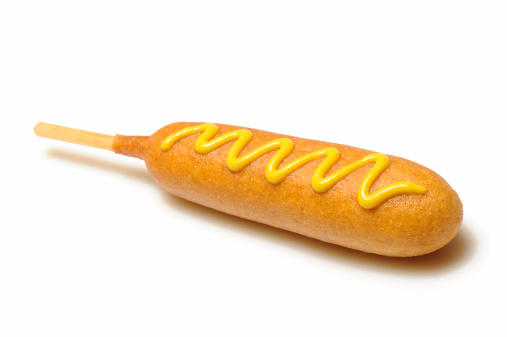 Corn dog with yellow mustard isolated on a white background. More pictures in lightbox...