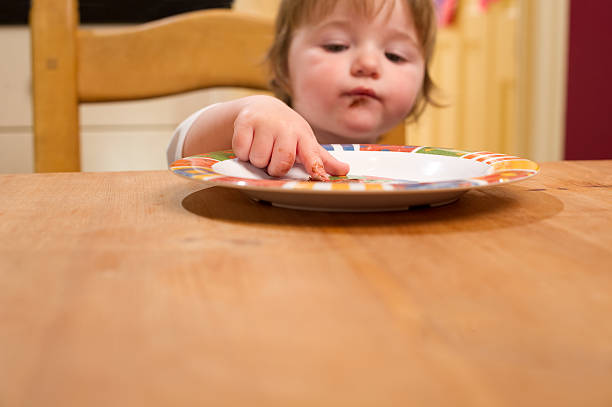 istock Baby Girl Eating 183363597