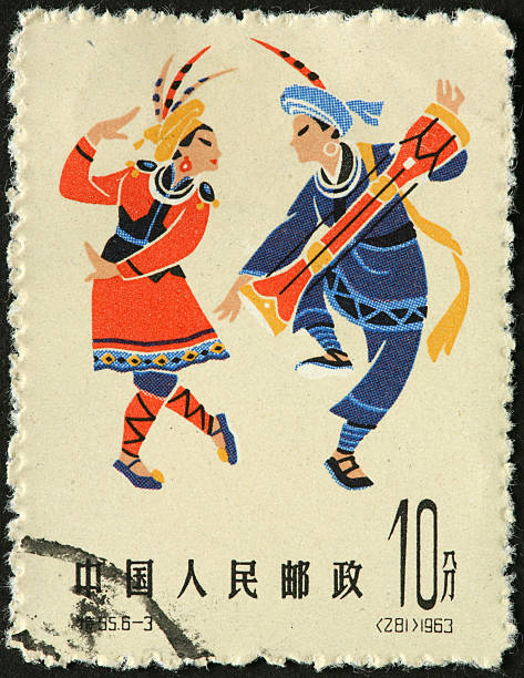 istock costumed drummer and dancer on an old Chinese stamp 183364116
