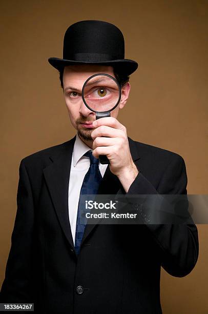 Man With Bowler Looking Through A Magnifier Stock Photo - Download Image Now - Magnifying Glass, Detective, Sherlock Holmes