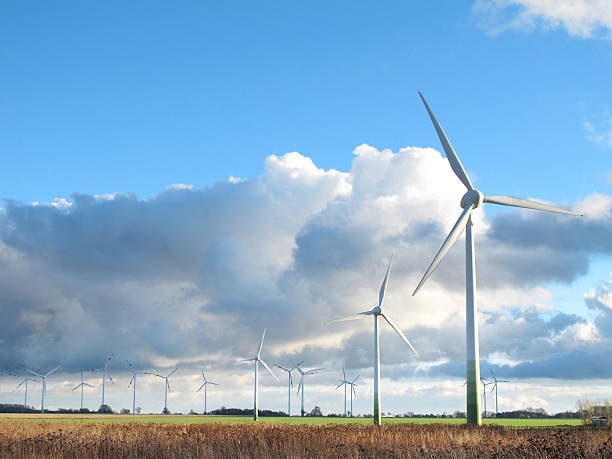 istock Wind Turbine and storm clouds with blue sky 183364966