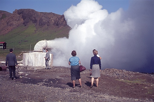 Iceland, 1964. Tourists in front of a diverted geyser in Iceland.