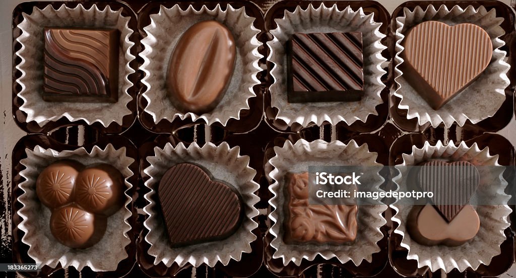 fresh chocolates close up shot of fresh chocolates in a row. Chocolate Stock Photo