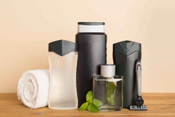 istock Men cosmetic bottles with mint leaves on table 1833654135