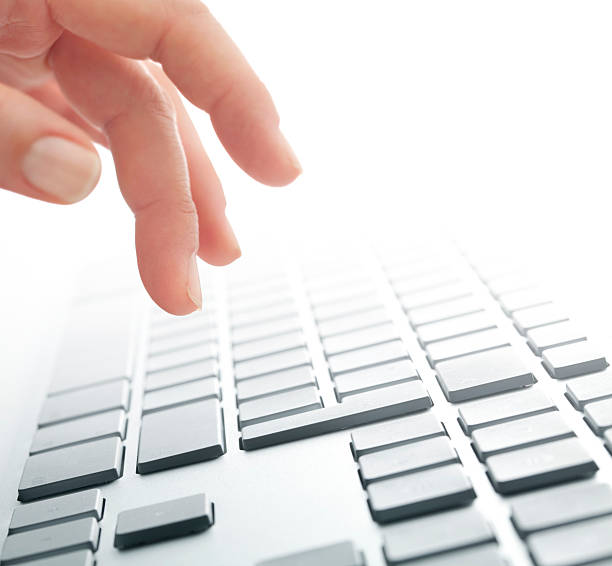 istock Hand poised above the keys on a computer keyboard 183365487